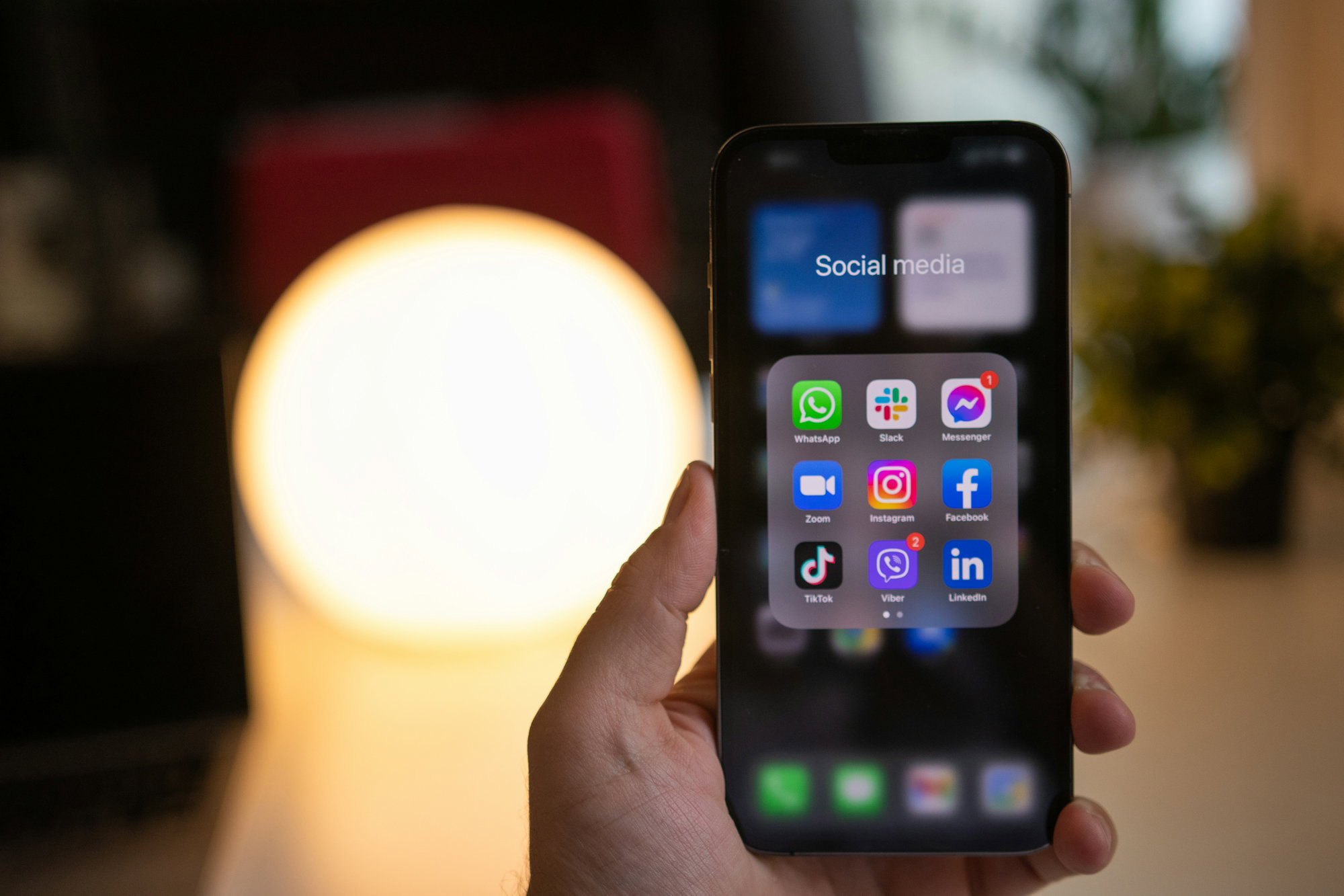 a-person-holding-a-phone.jpg a person holding a phone