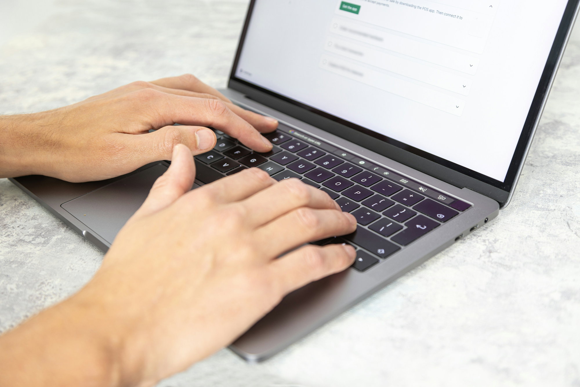 a-person-typing-on-a-laptop.jpg a person typing on a laptop