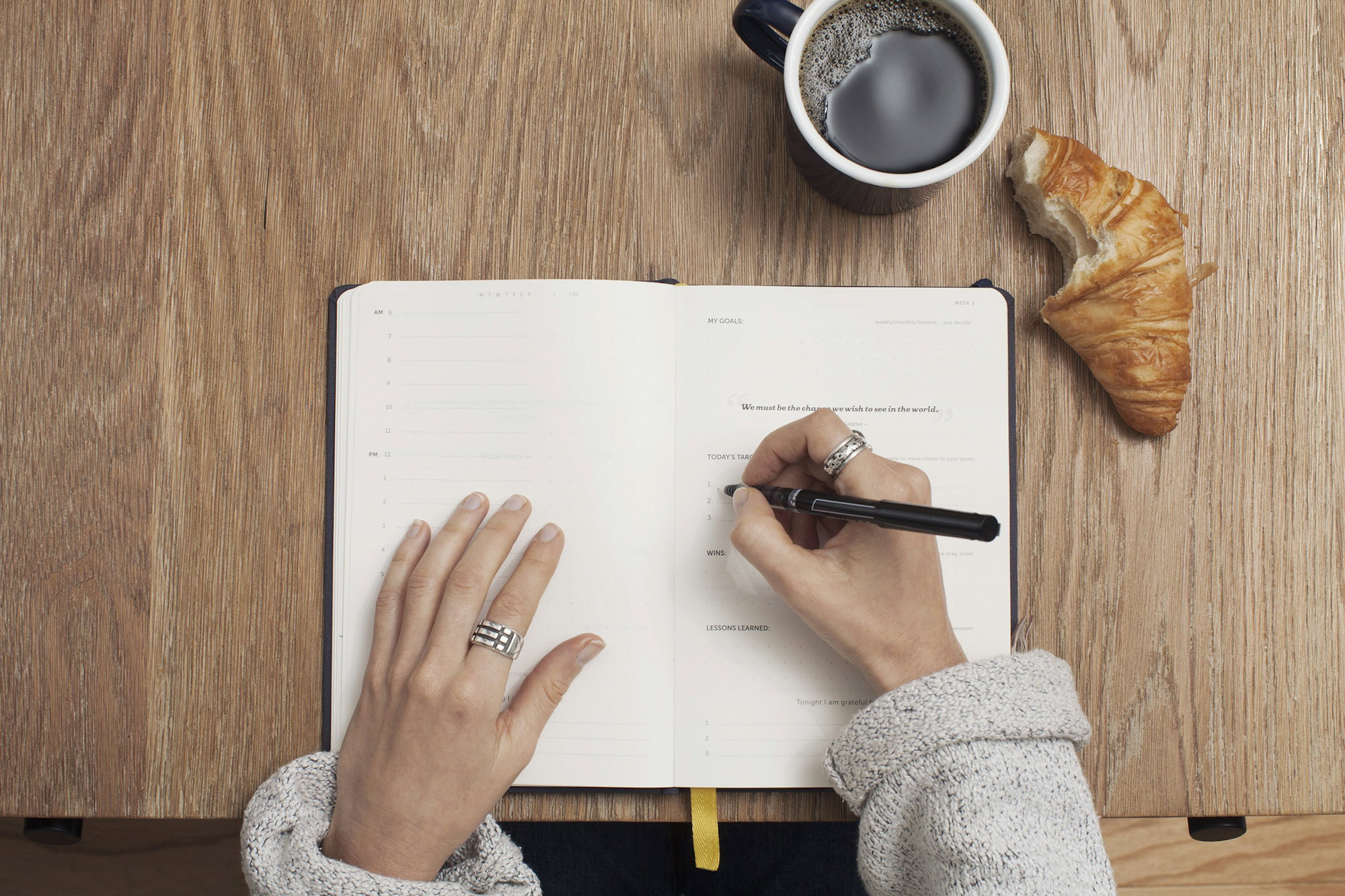 person-writing-on-a-book.jpg person writing on a book