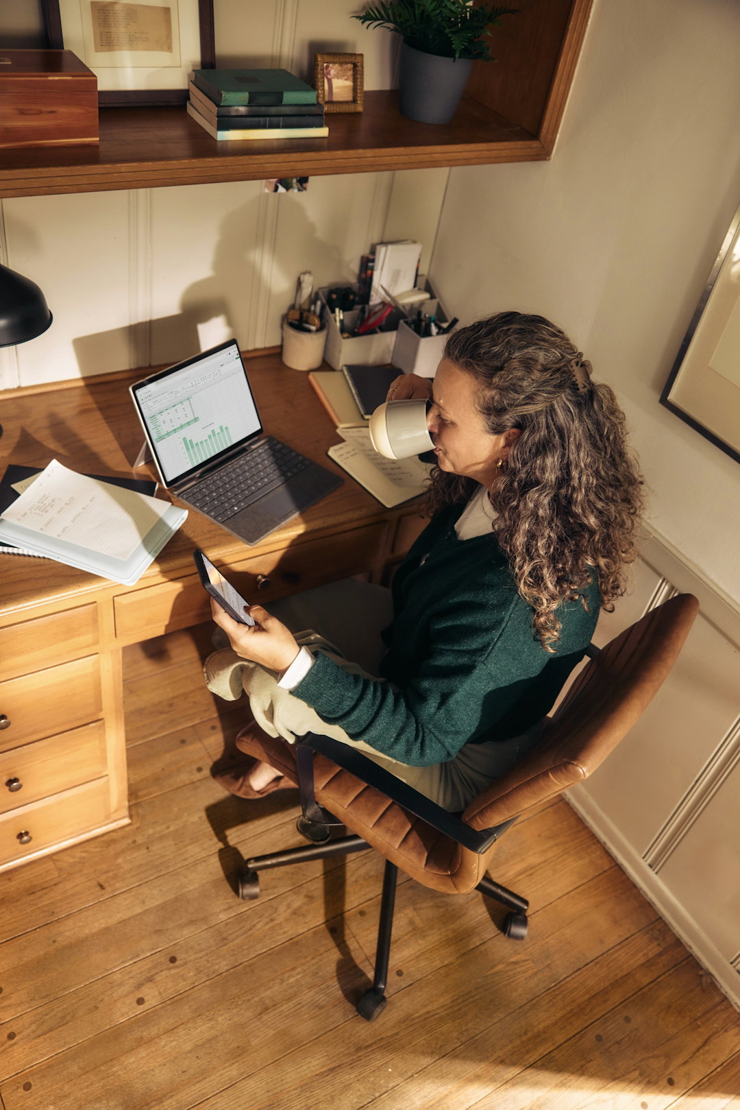 woman-working-at-a-desk-with-laptop-and-tablet.jpg Woman working at a desk with laptop and tablet